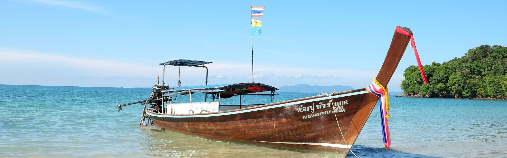 Tranquil Krabi shoreline at dawn for a Krabi Tours banner by Legend Travel Group.